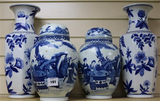 A pair of Chinese blue and white jars and cover and a pair of blue and white vases